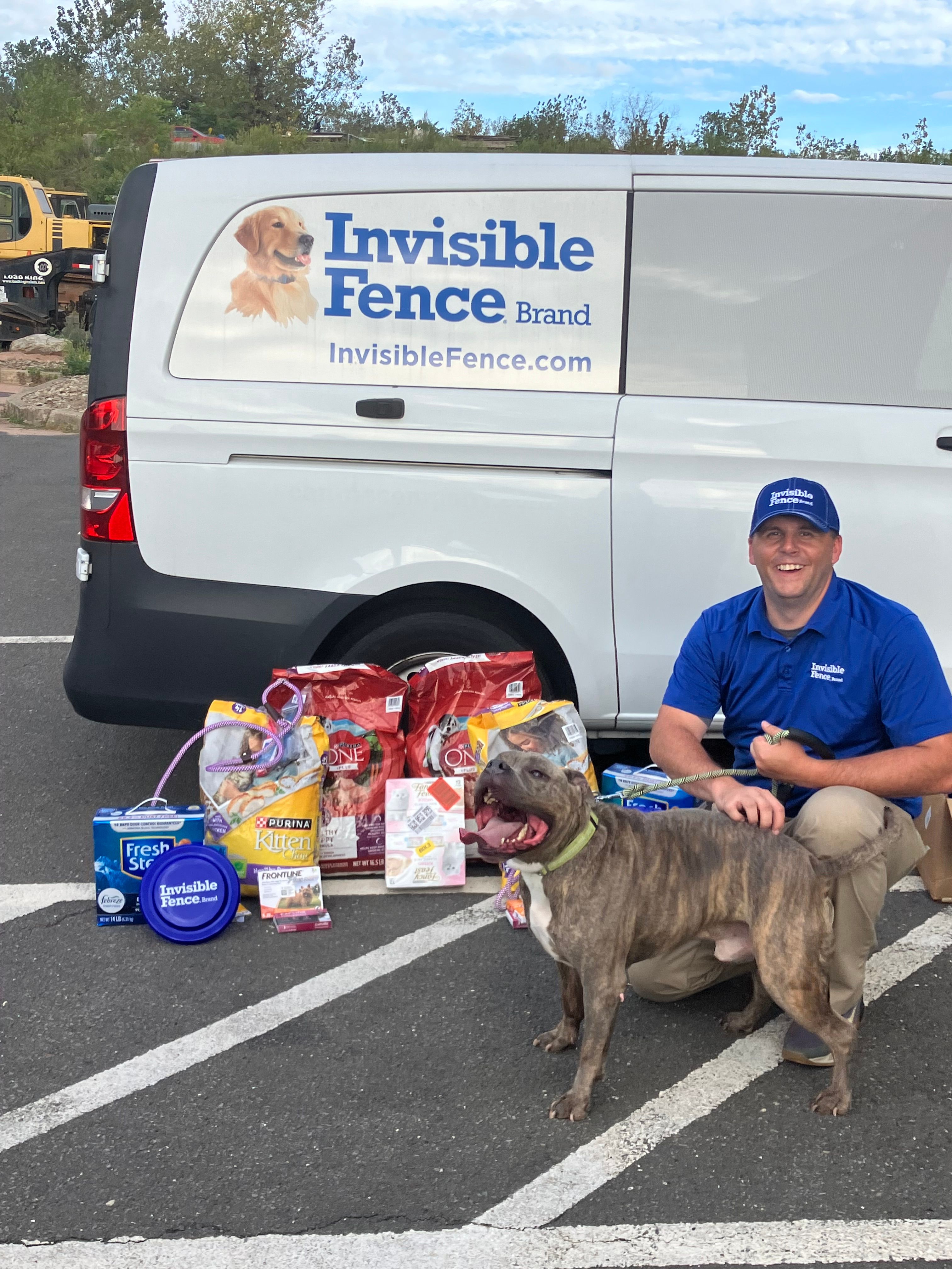 Invisible Fence trainer and bully mix at a donation event in Connecticut 