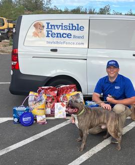 Invisible Fence trainer and bully mix at a donation event in Connecticut