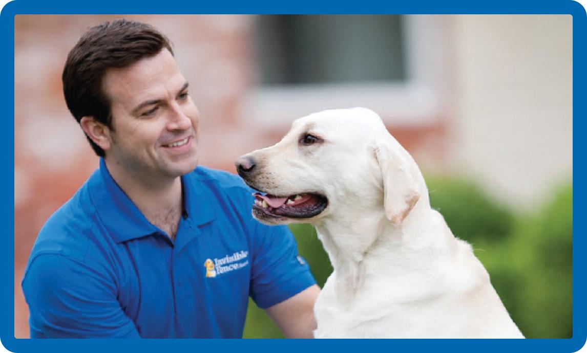 Invisible Fence® trainer with smiling dog