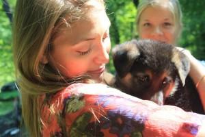 woman holding puppy