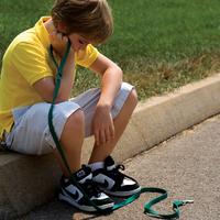 sad boy holding leash
