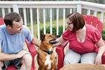 couple sitting with dog