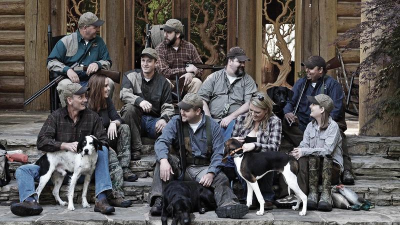 Group photo of SportDOG team meambers with their dogs