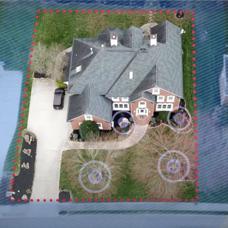 Aerial view of house with fence boundary outlined surrounding property