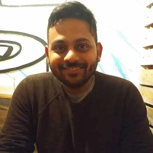 Peeyush Singla, Senior Fullstack Engineer at METYCLE; person wearing dark clothes in front of a light background, smiling and looking directly at the camera