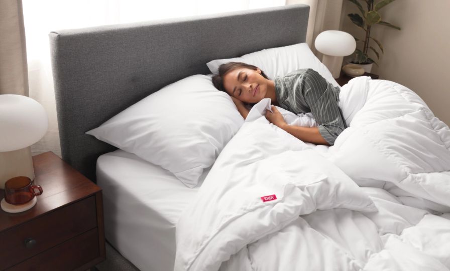 Person sleeping on an Endy Mattress outfitted with The Endy Everyday Sleep Set.