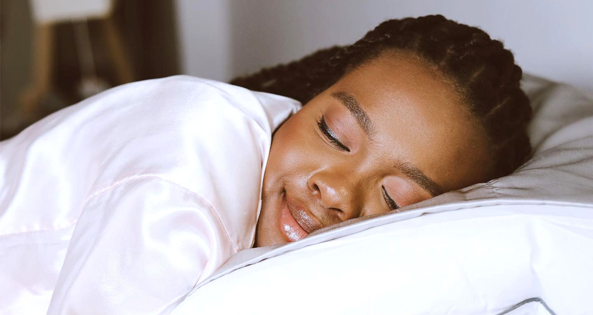Woman dozing comfortably on a pillow.