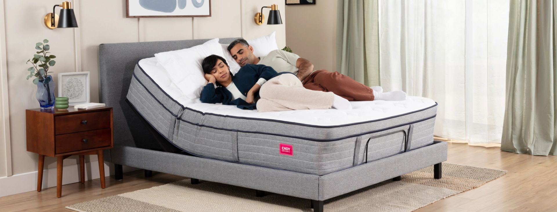 Couple lying on an inclined adjustable bed