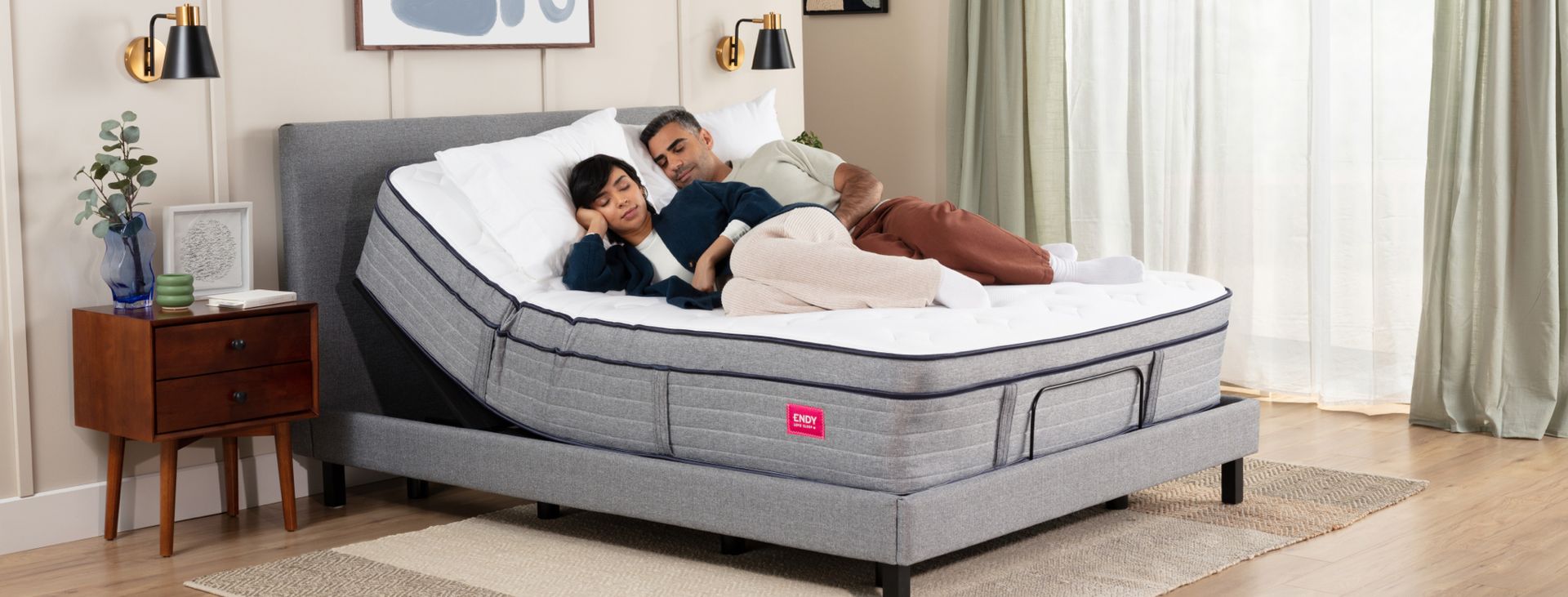 Couple lying on an inclined adjustable bed