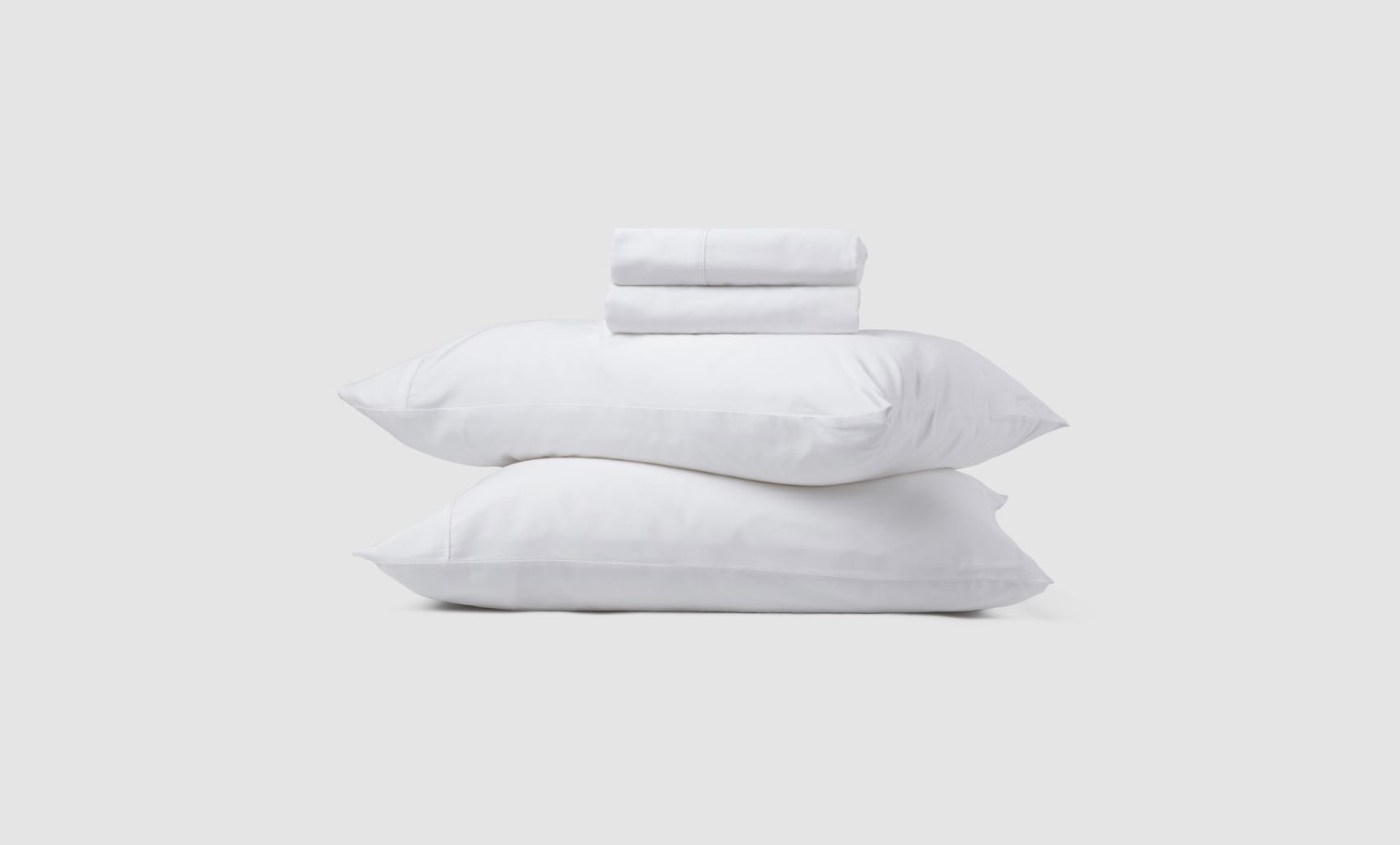 The Organic Cotton Sheet Set is available in three colours: Glacier Blue, Alpine White, Storm Grey.