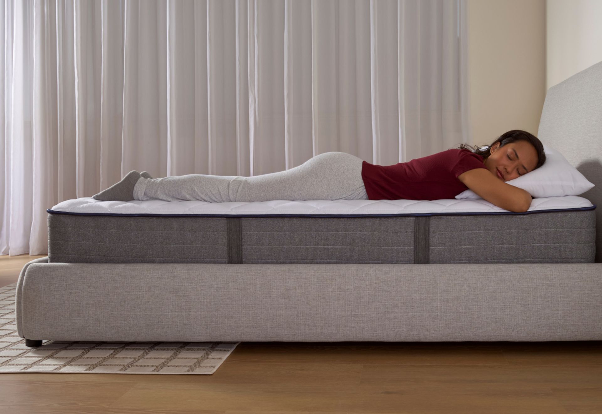 Woman sleeping peacefully on an Endy Elevate Hybrid
