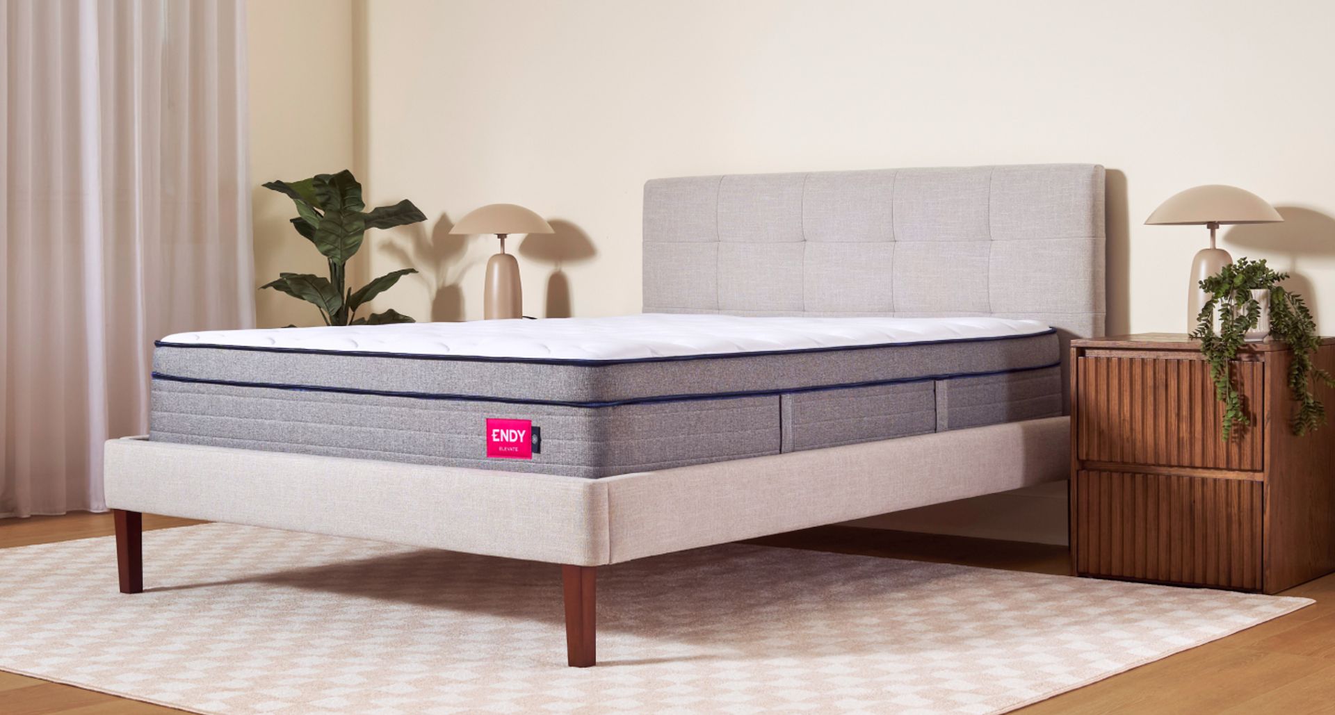 Bare Endy Elevate Hybrid mattress on a white bed frame in a minimalist bedroom