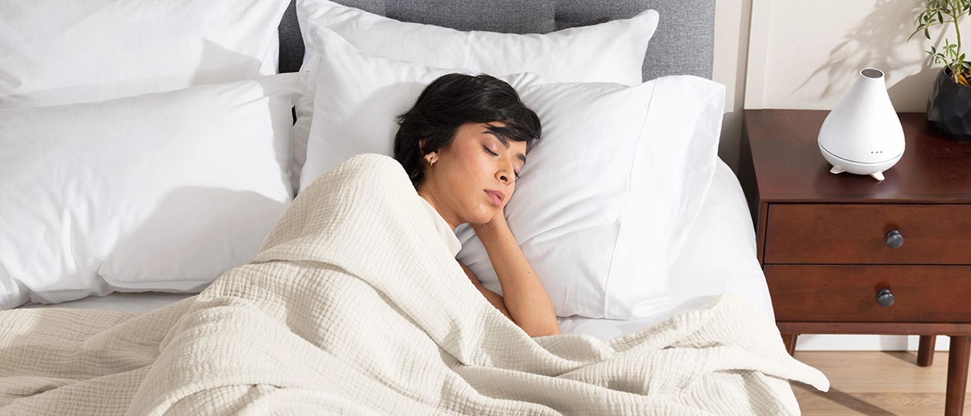 Woman sleeping covered by an Endy Muslin Blanket