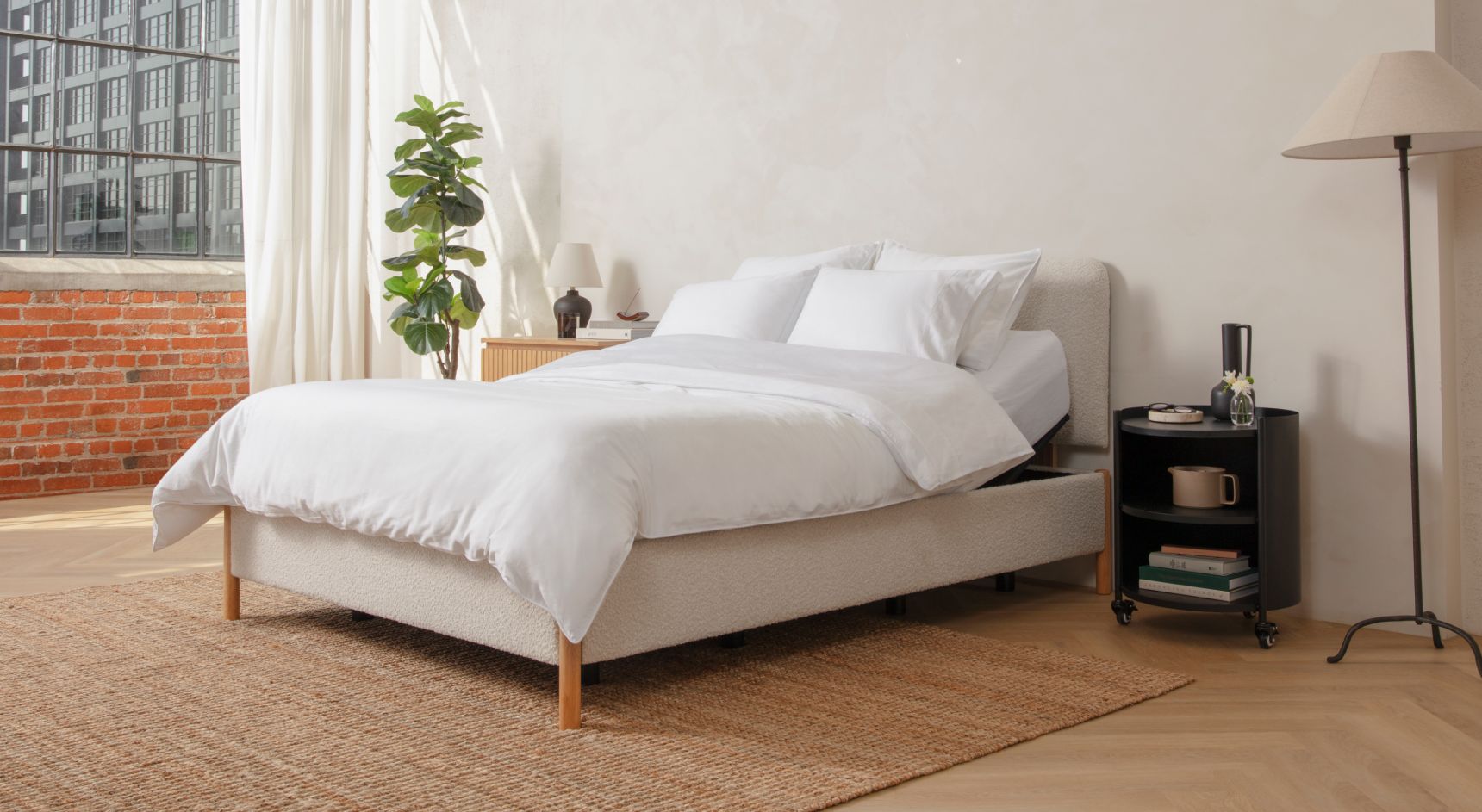 Adjustable bed on a white upholstered bed frame
