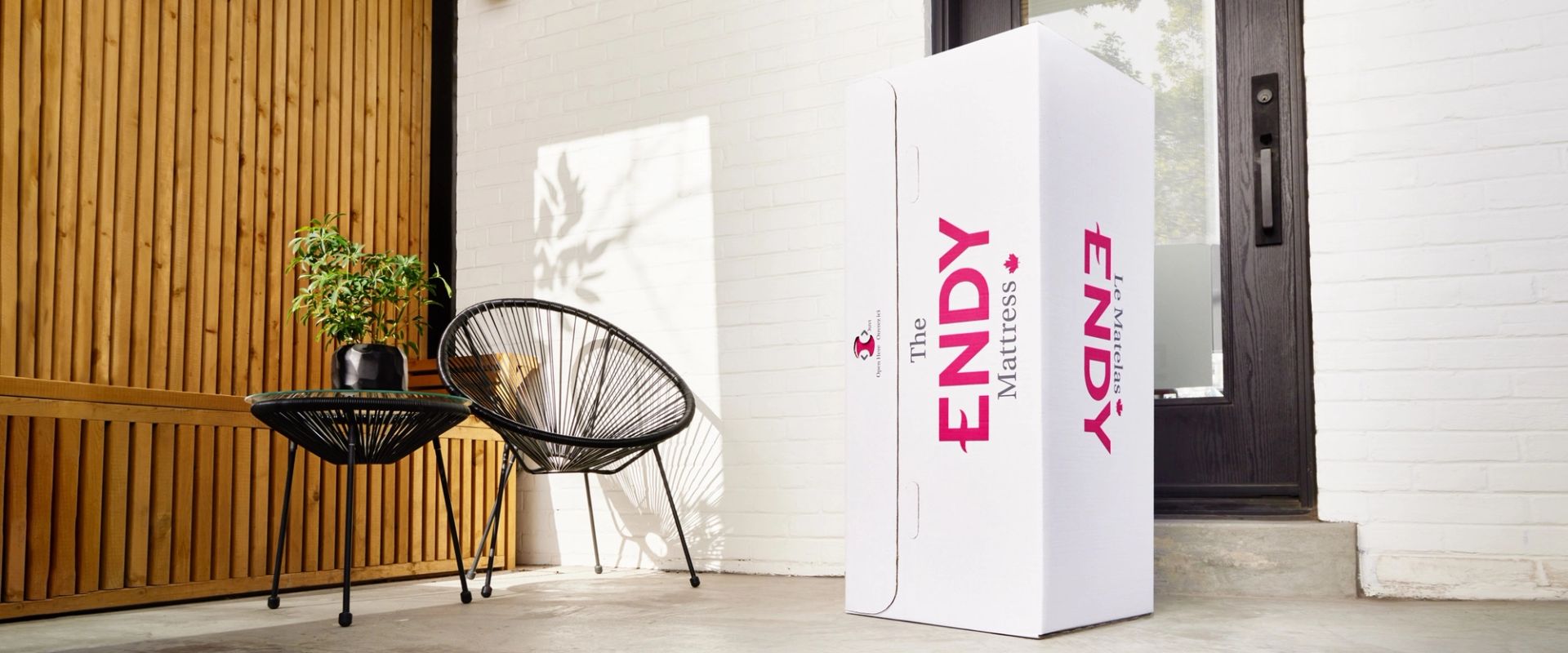 An Endy box sits on the front porch of a house