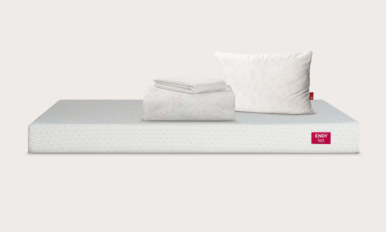 The Big Bed Starter Bundle includes a mattress protector, a pillow
