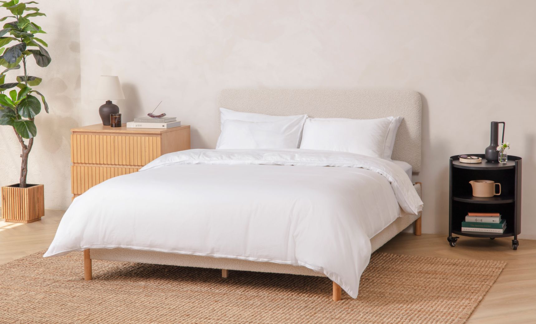 Upholstered Platform Bed in cream colour with natural colour legs