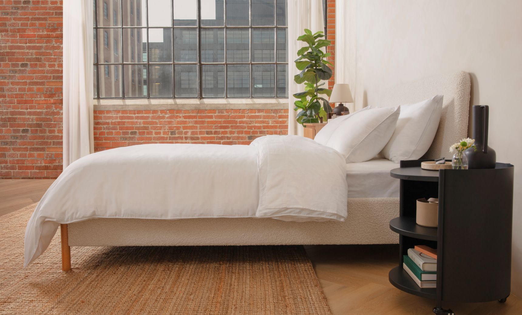 Upholstered Platform Bed in cream colour with natural colour legs