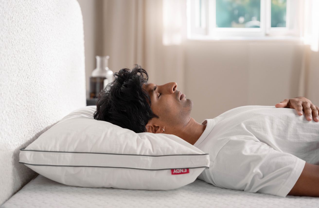 Person sleeping on an Endy Customizable Pillow
