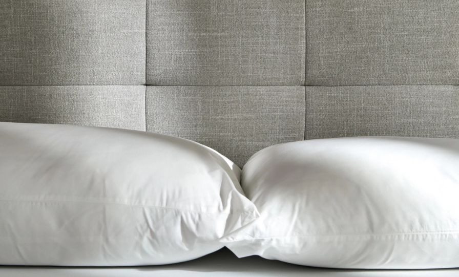 Bedroom featuring the tufted upholstered bed frame in ash grey with the wooden nightstand.