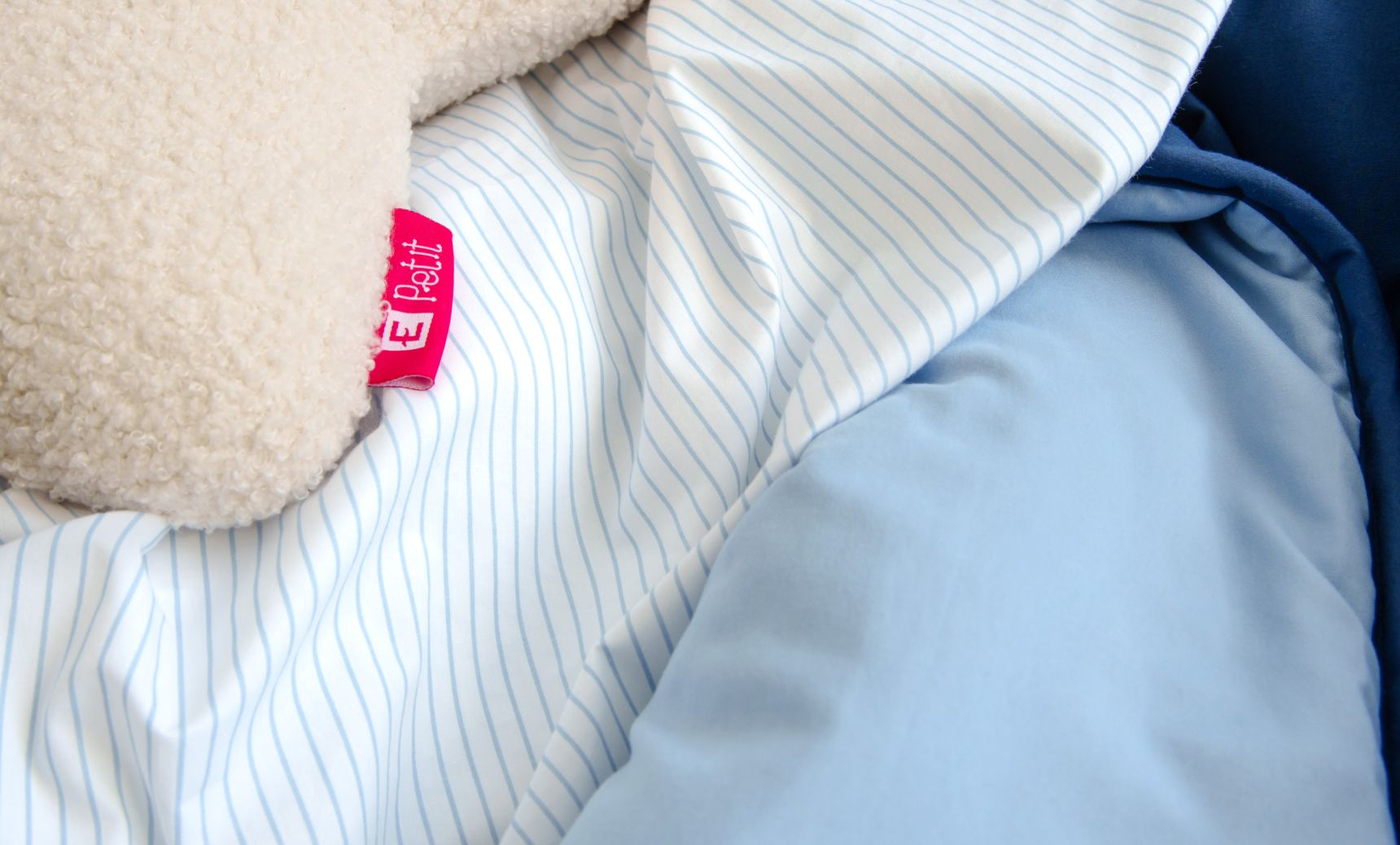 Close up of Endy Petit blue and chambray stripes sheet set