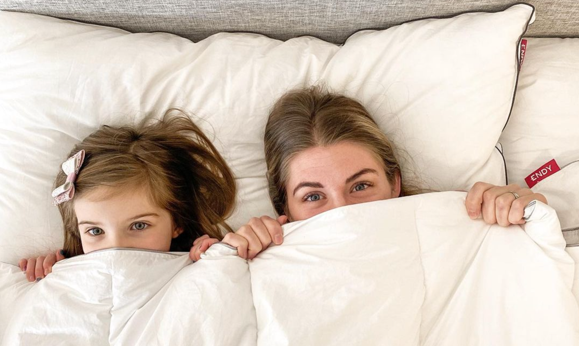 Mother and daughter in bed with their Endy Duvet.
