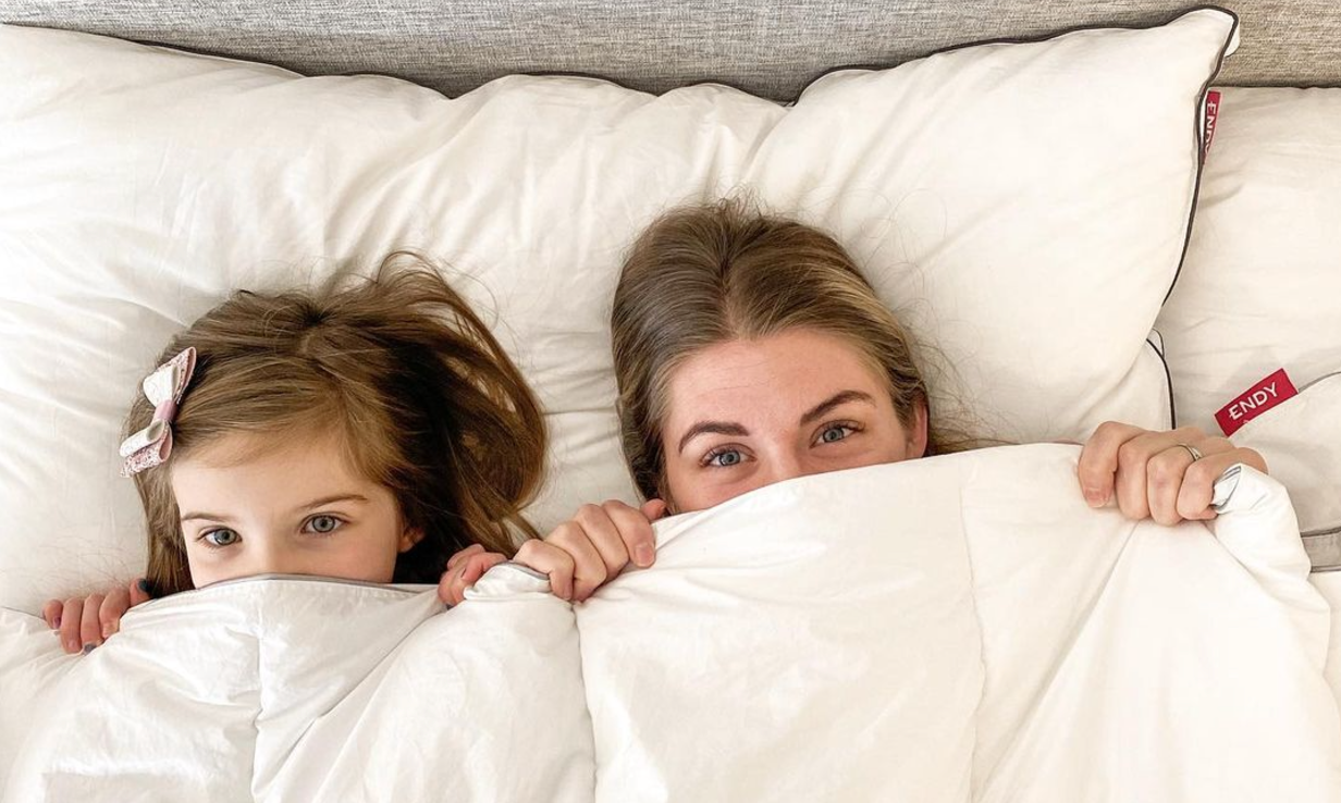 Mother and daughter in bed with their Endy Duvet.