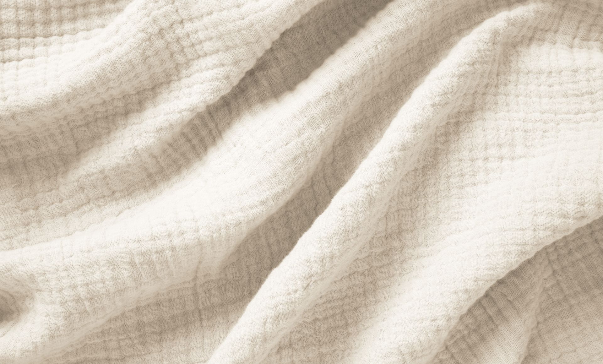 The Endy Muslin Blanket in Soft Cream colourway