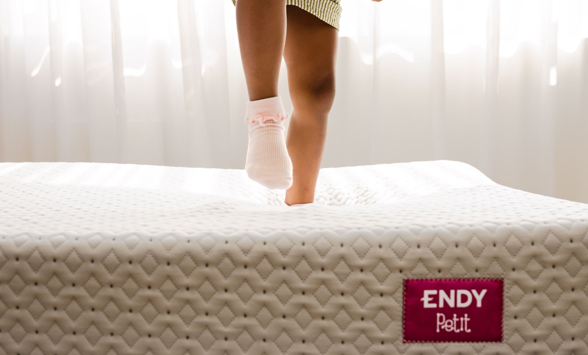 Kid jumping on the Endy Petit Mattress