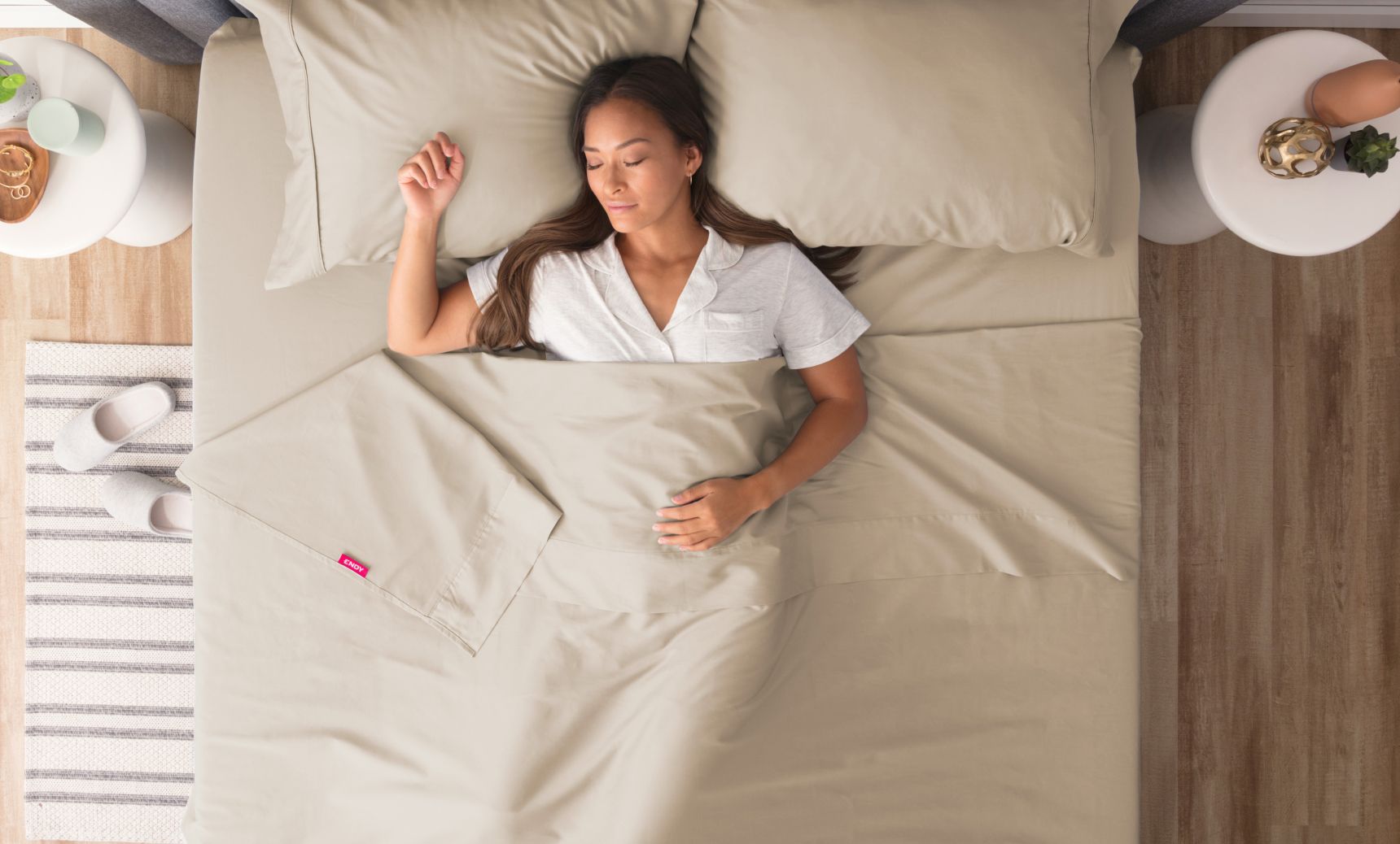 Woman sleeping peacefully under beige Endy Sateen sheets