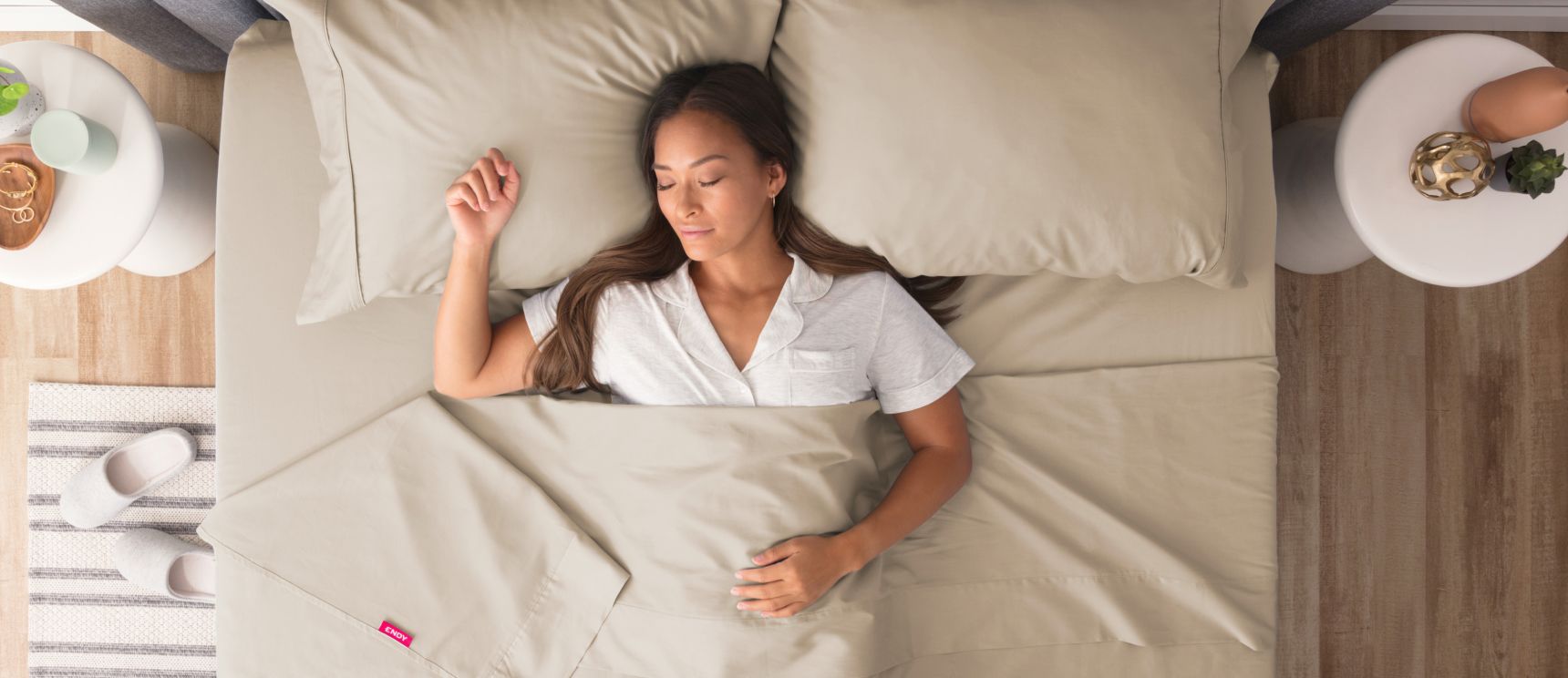 Woman sleeping peacefully under beige Endy Sateen sheets