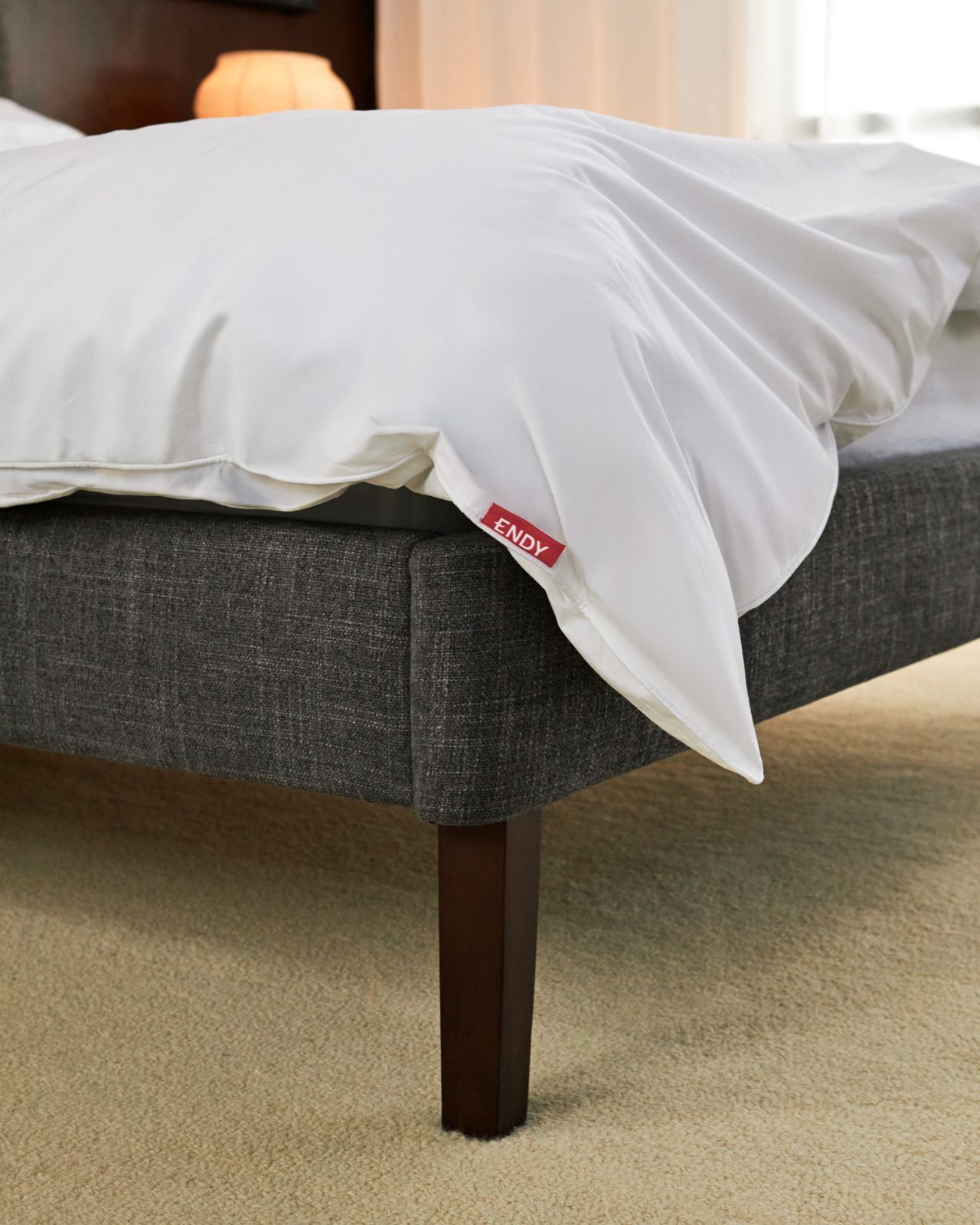 Bedroom with channel upholstered bed frame in graphite colourway.