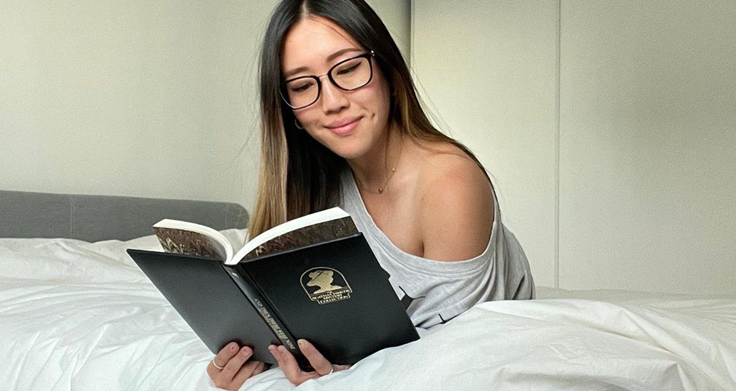Image of a woman lying on her stomach in bed 