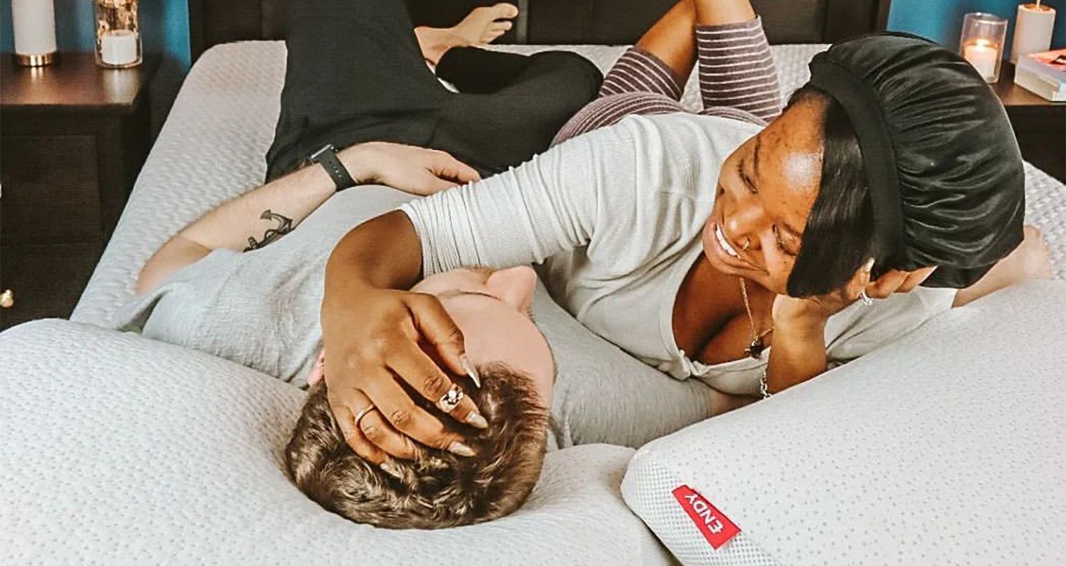 Man and woman laying on Endy Memory Foam Pillows. Image by @dom.creates