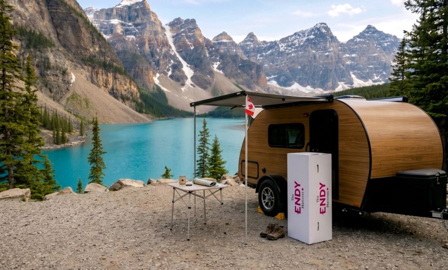 A camper trailer parked with an Endy RV Mattress box at Banff National Park.
