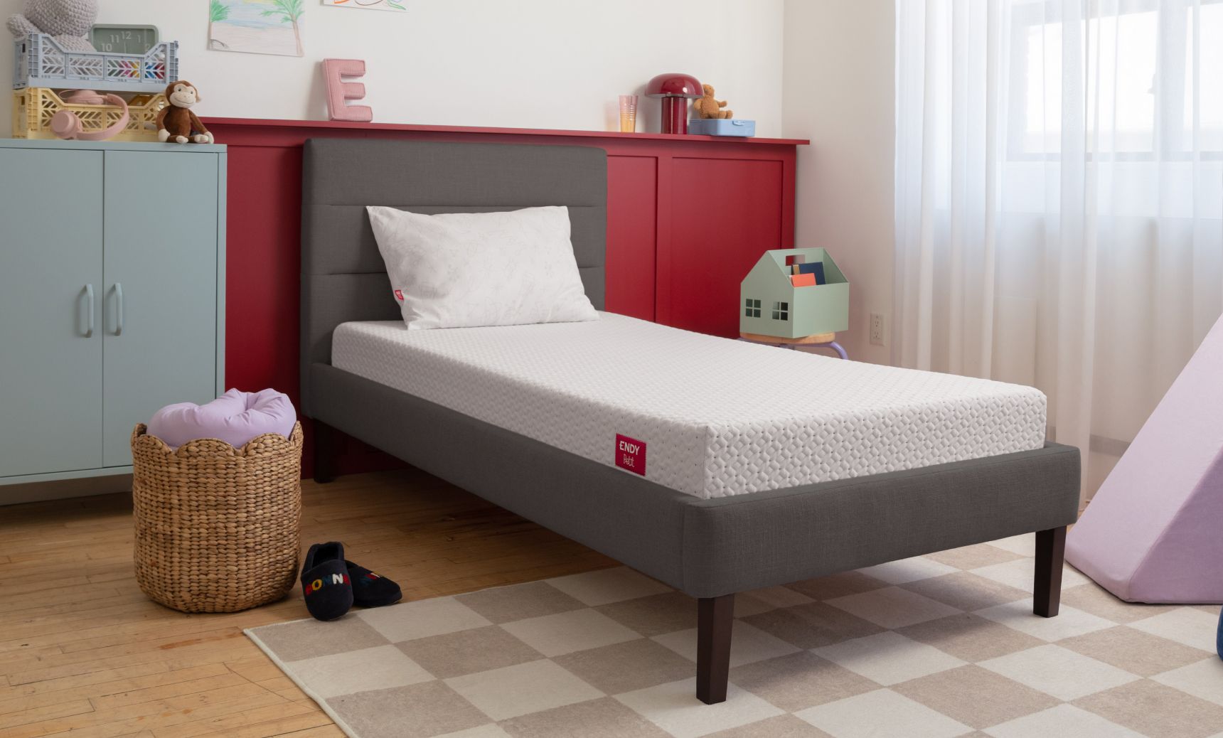Endy Petit mattress on a grey bed frame in a child's room