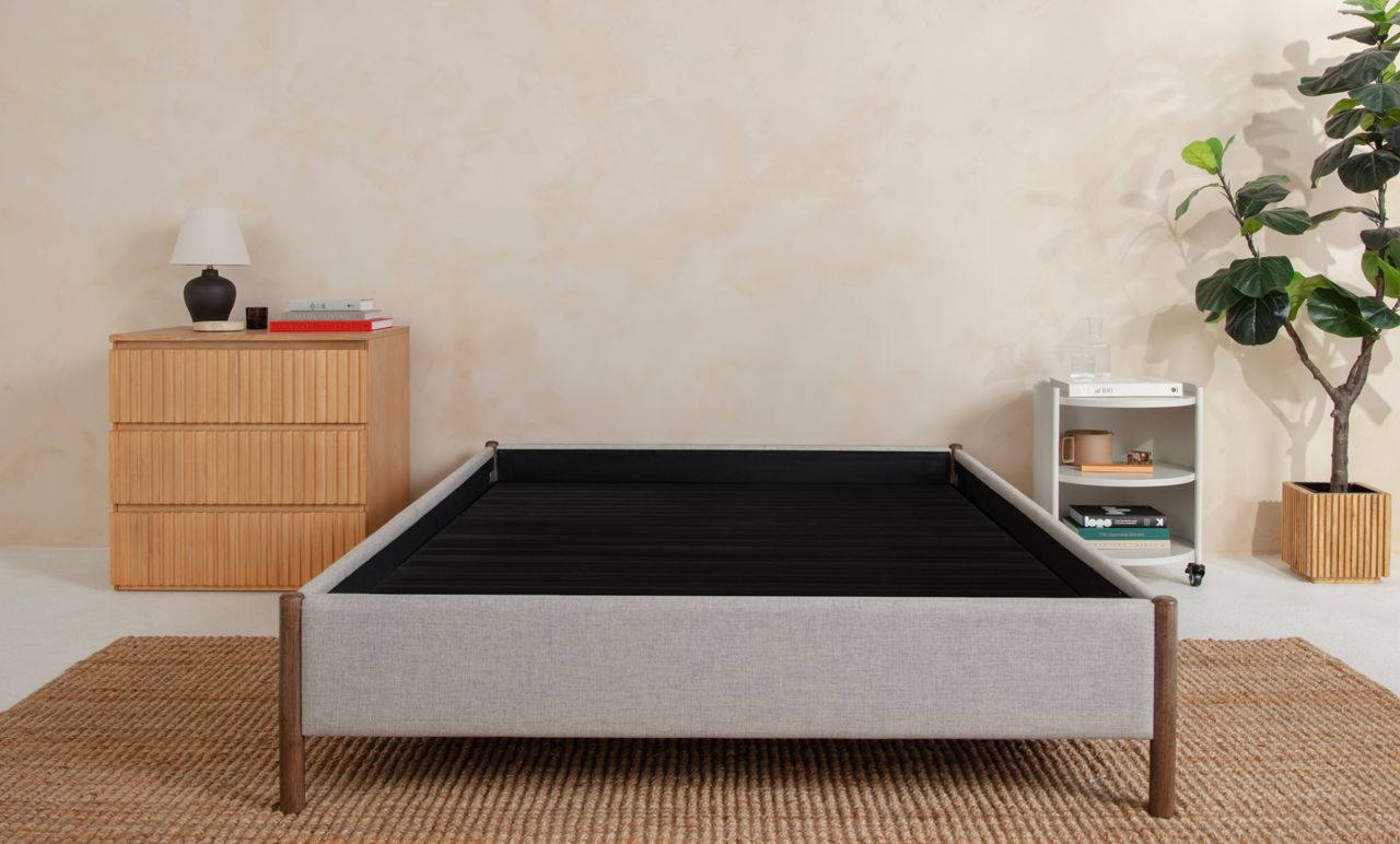 Upholstered Platform Base in grey colour with smoke colour legs