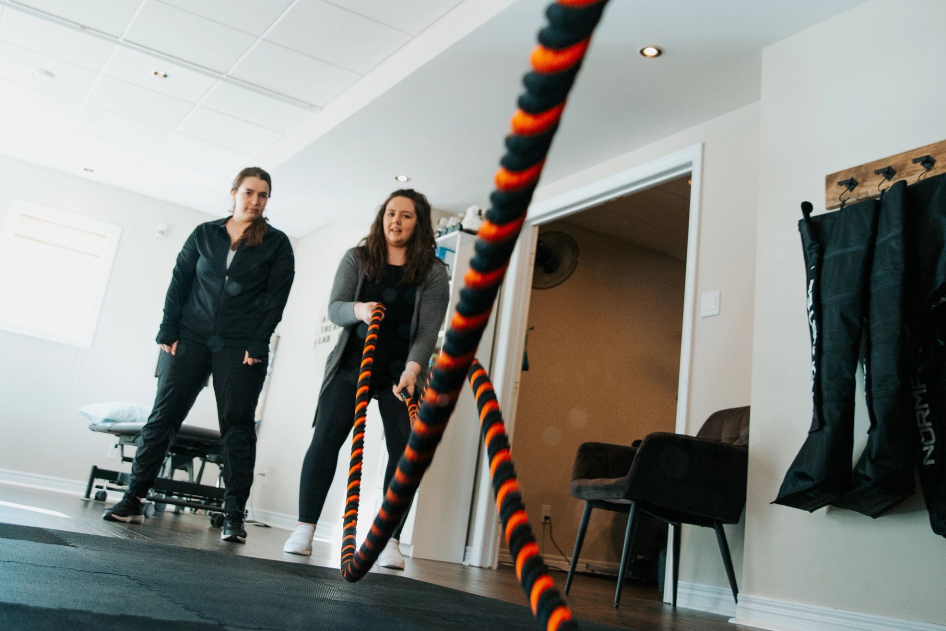 Ashley using a rope to exercise with a client