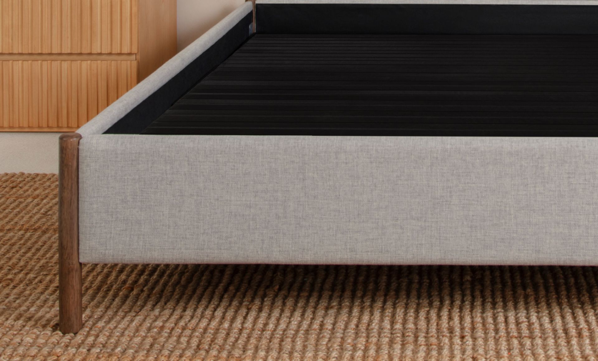 Upholstered Platform Base in grey colour with smoke colour legs