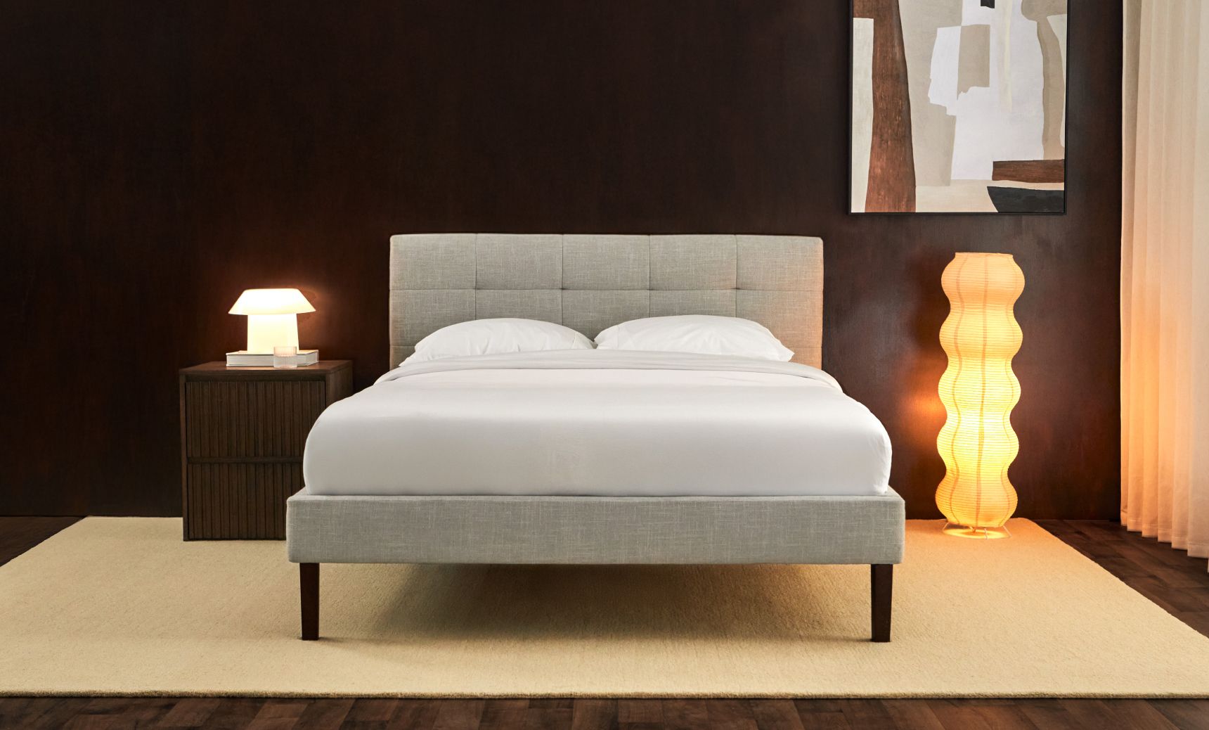 Close-up of the tufted upholstered headboard, and the Endy Hybrid Mattress.