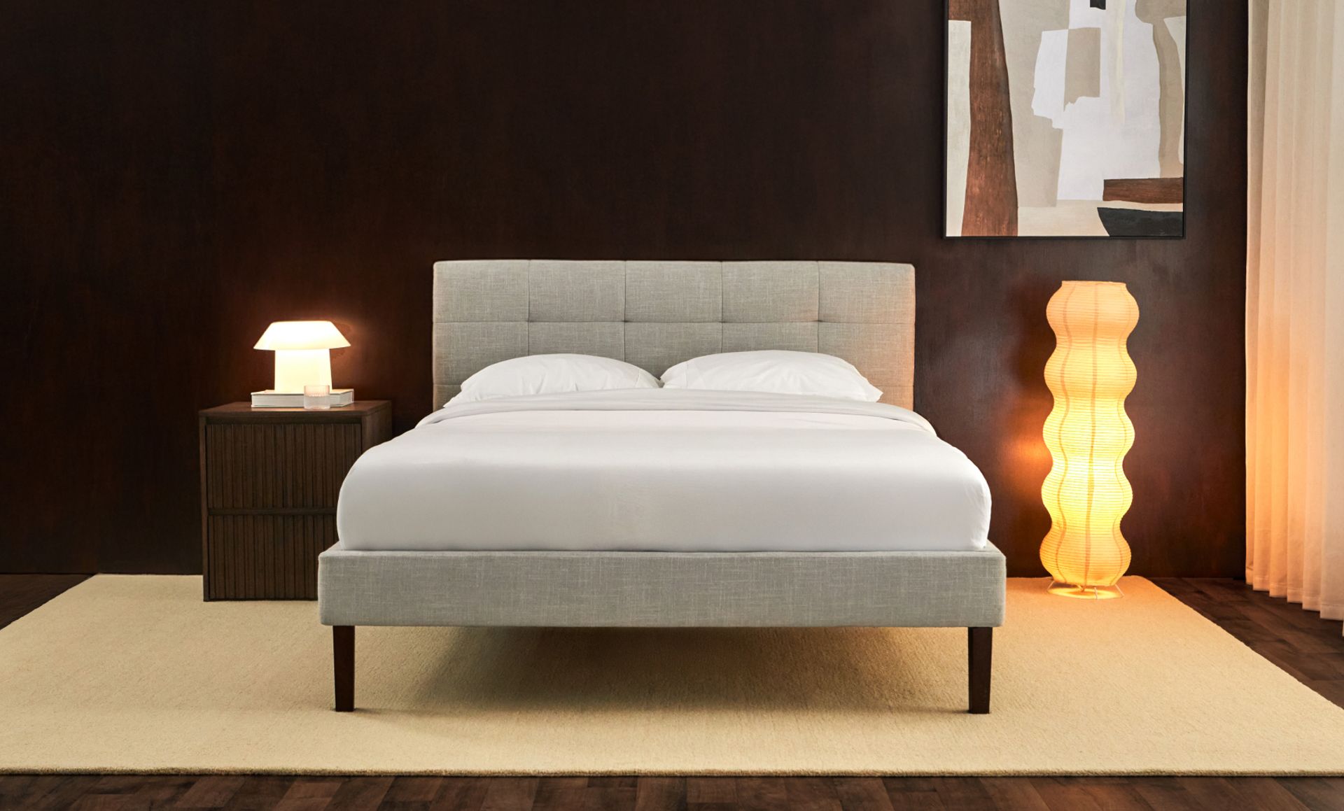 Close-up of the tufted upholstered headboard, and the Endy Hybrid Mattress.
