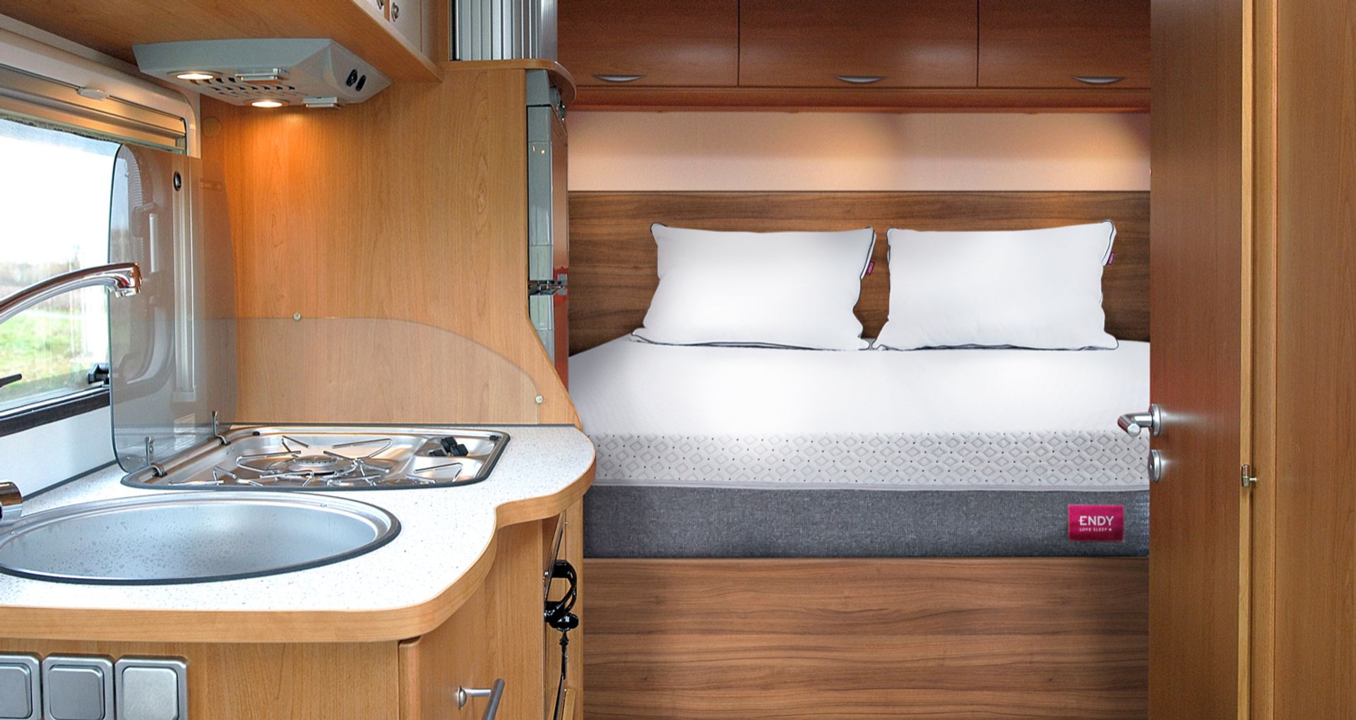 An Endy RV Mattress with two Endy Customizable Pillows inside an RV.