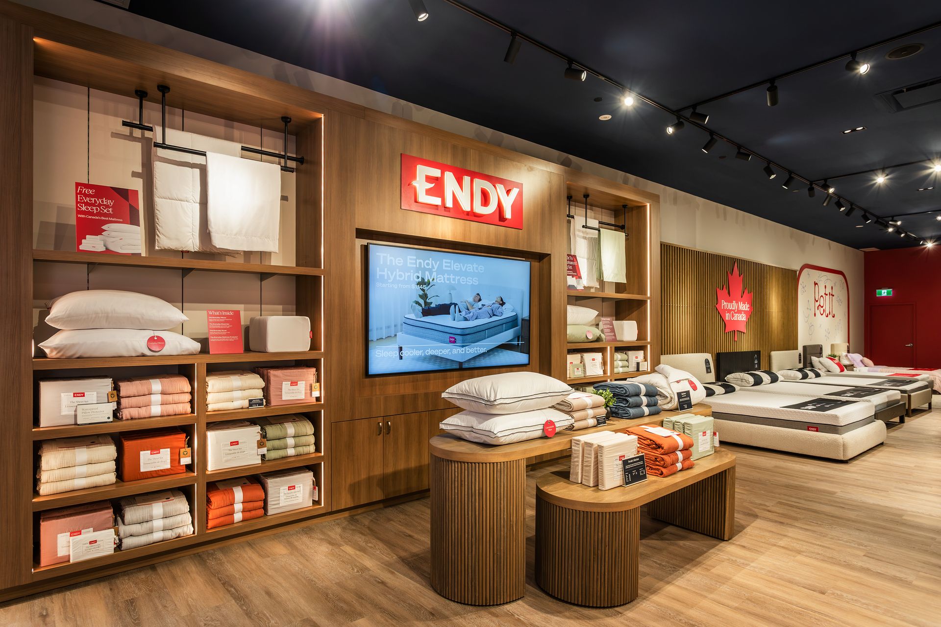 Inside of Endy Bayshore store, with tables of sheets and pillows