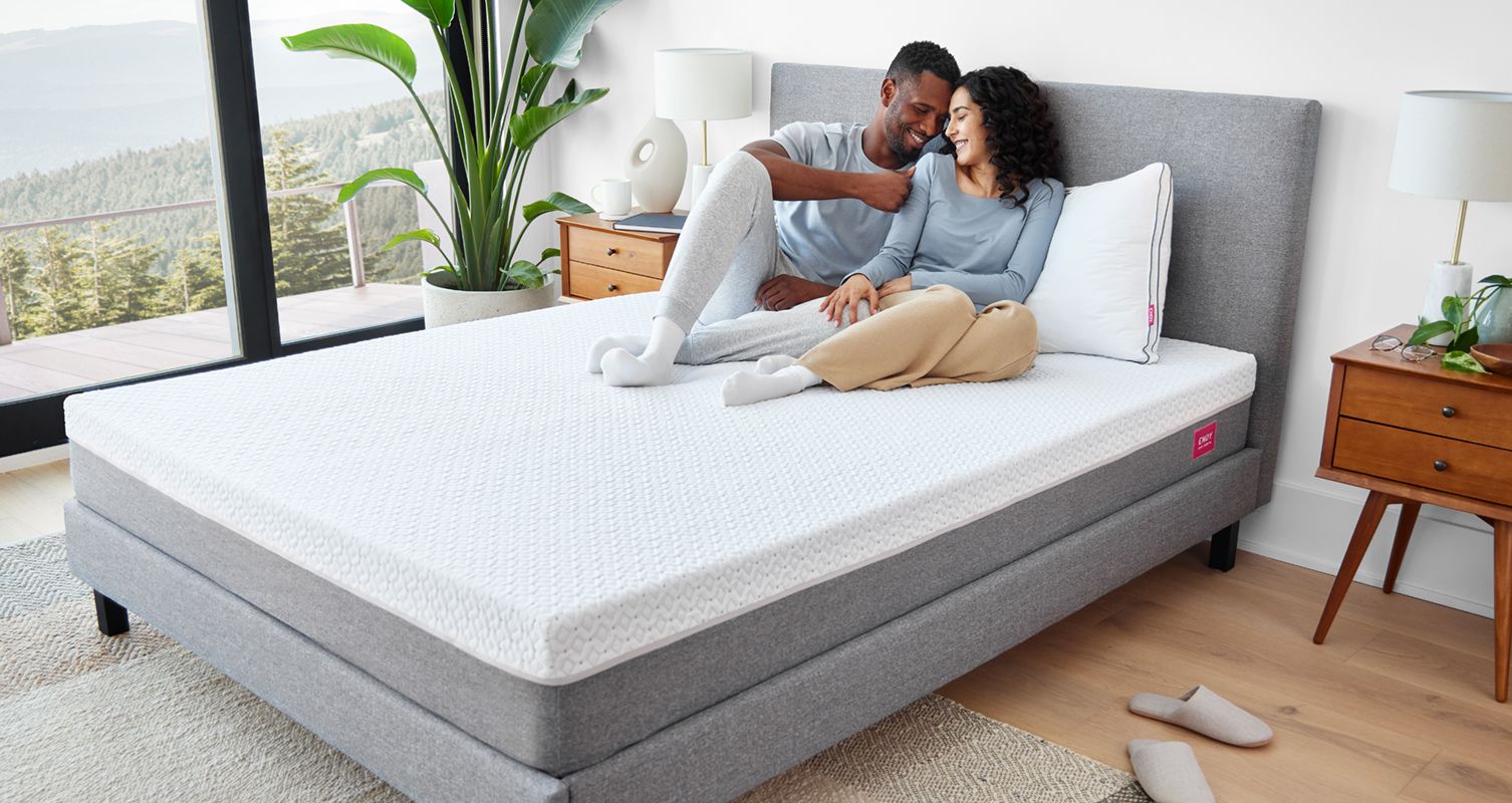 A couple sitting up on their Endy Mattress