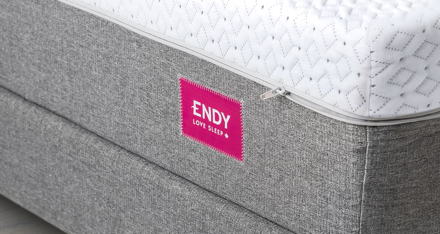 Close-up image of the Endy Mattress's outer cover with zipper. 