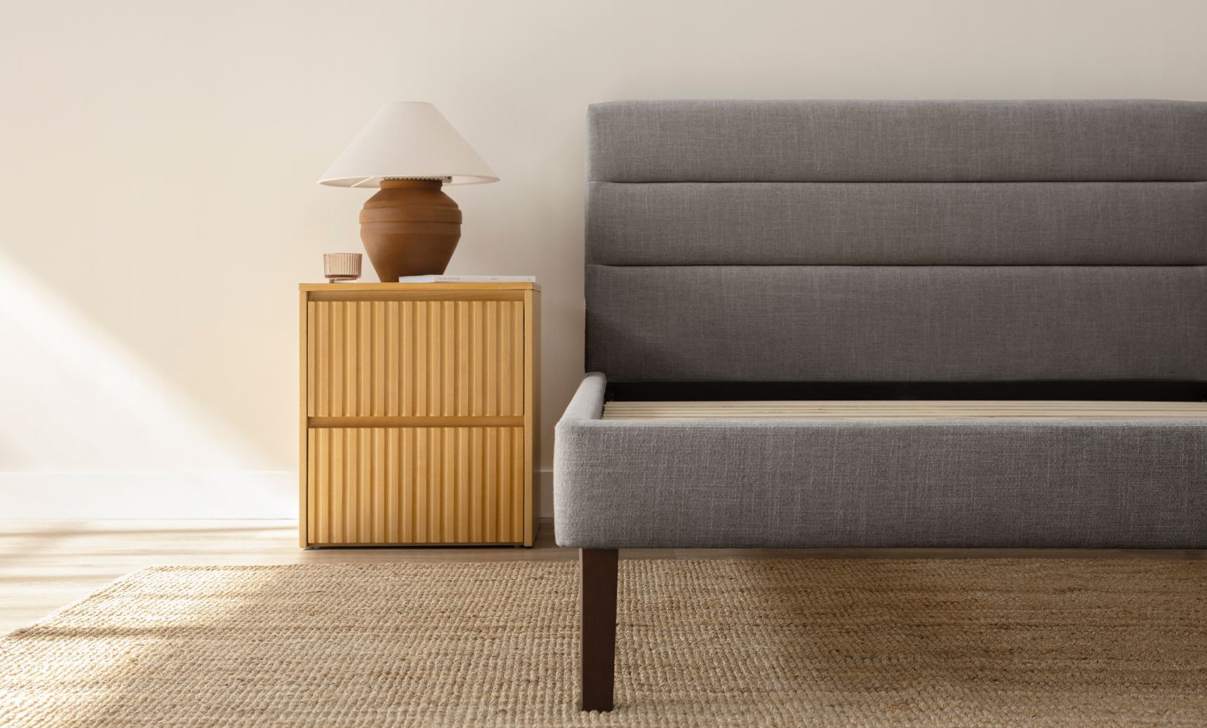Bedroom with channel upholstered bed frame in graphite colourway.