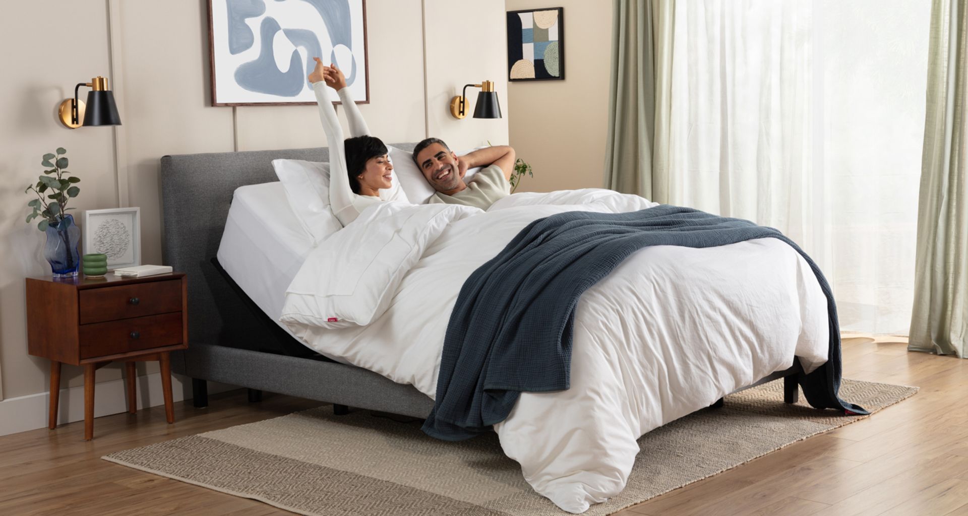 Woman and man wake up in an inclined adjustable bed