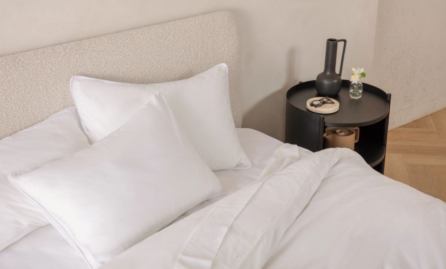 Upholstered Platform Bed in cream colour with natural colour legs