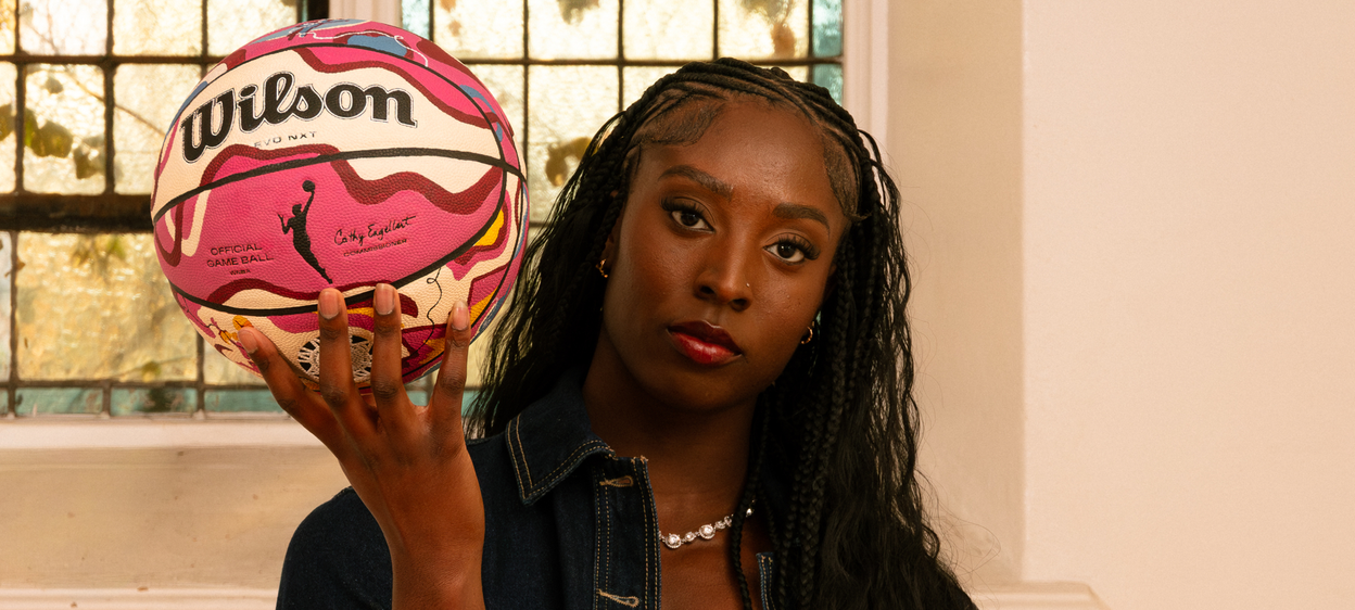 Laeticia Amihere holding a WNBA basketball