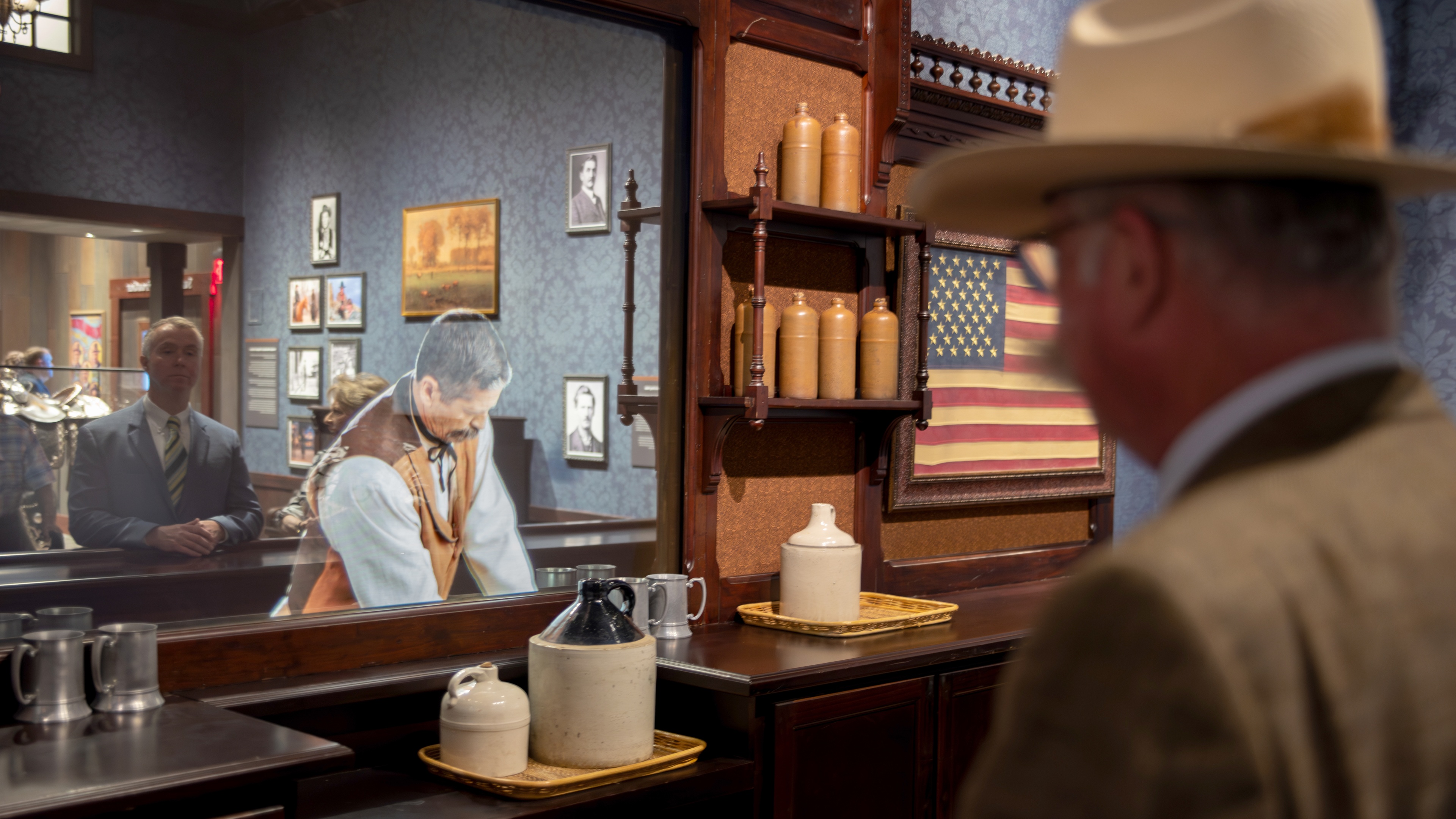 Mirror with image of a bartender dressed in a wild west outfit